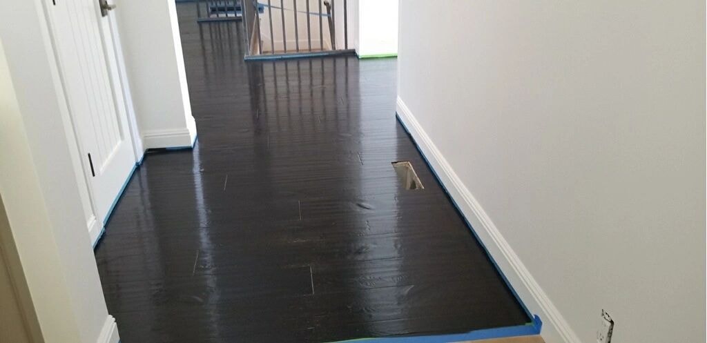 Hallway with dark hardwood flooring installation
