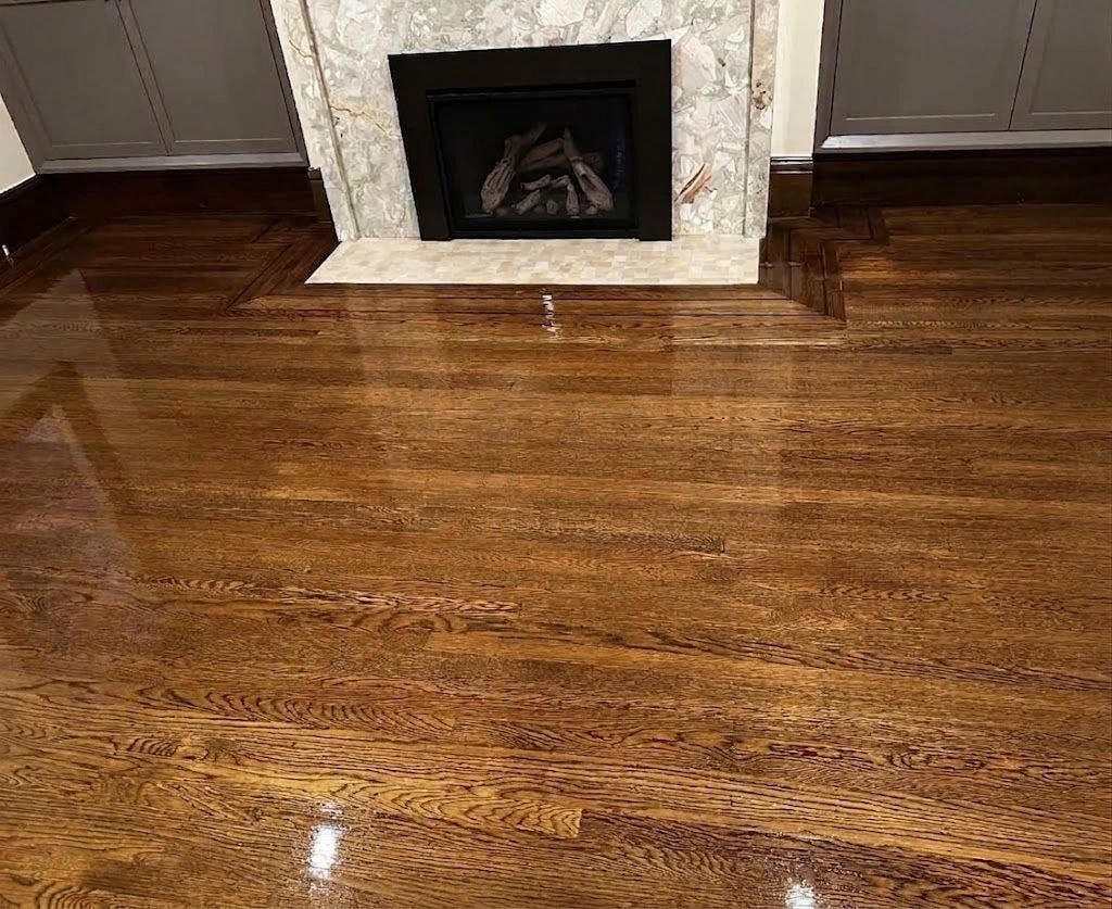 Hardwood floor with fireplace and marble surround