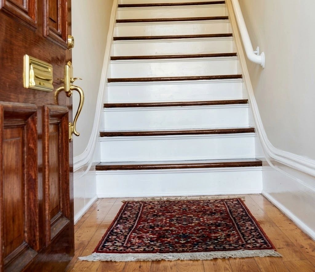 Wooden staircase with dark treads and white risers